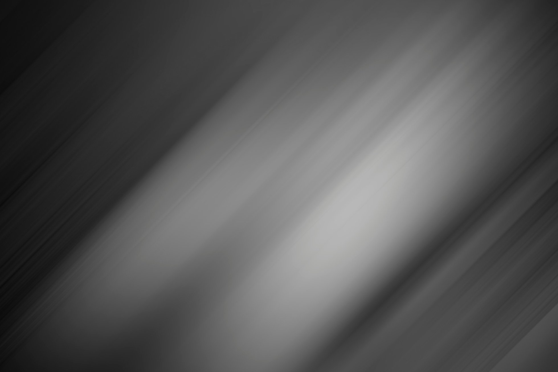 Black and gray background with gradient and silver light as background.